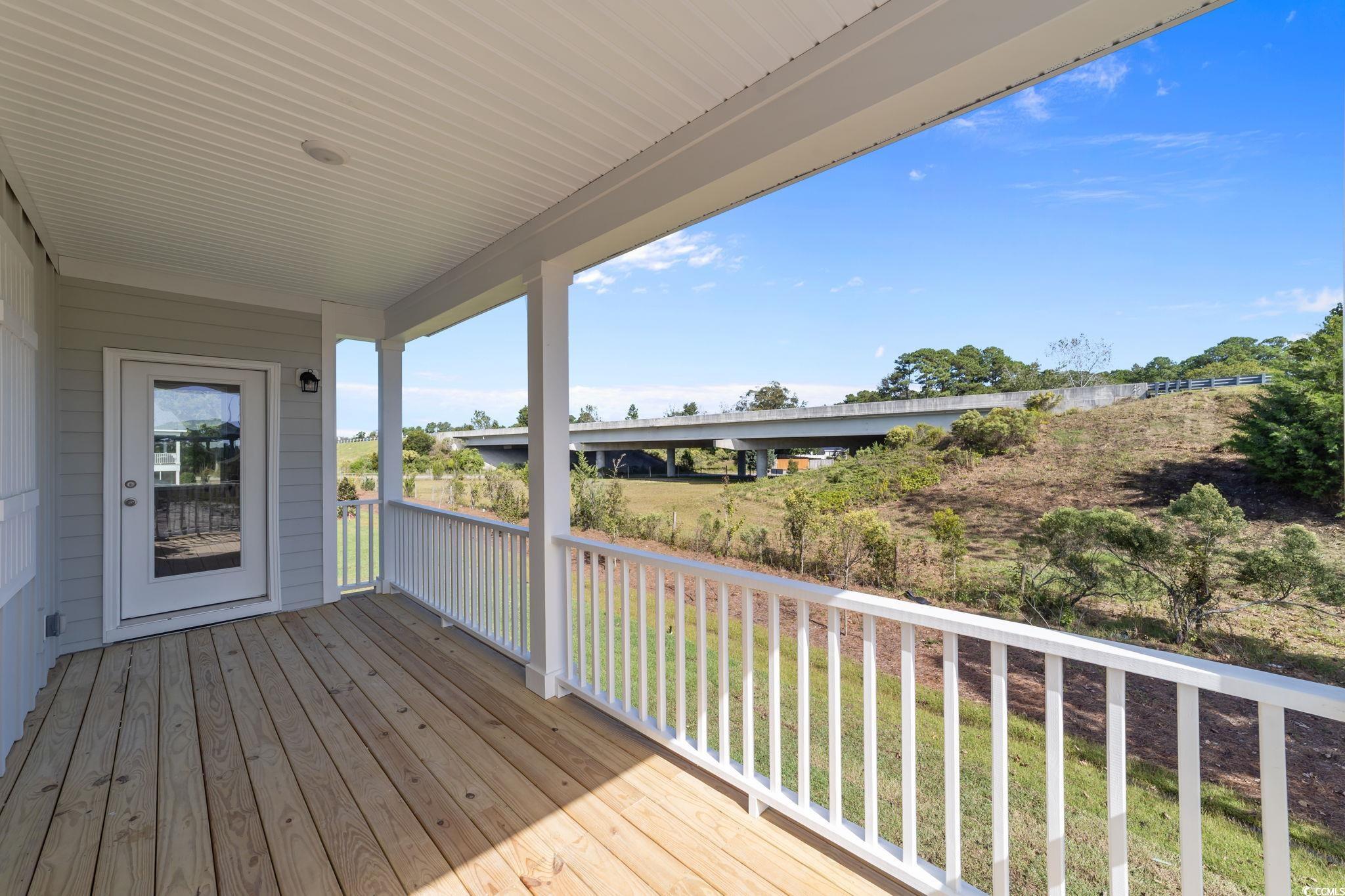 775 Ebb Tide Road Little River, SC 29566 - Photo 7 of 39 Deck featuring a lawn