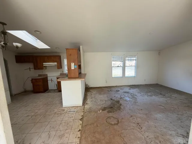 a view of a kitchen with a sink and a window