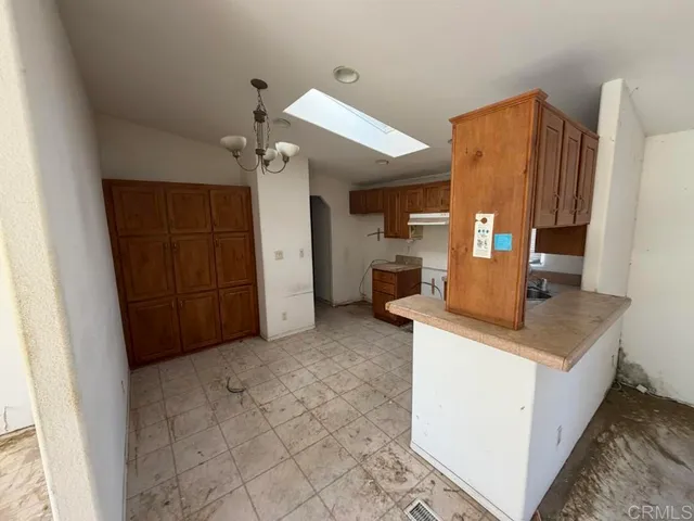 a view of kitchen with cabinets