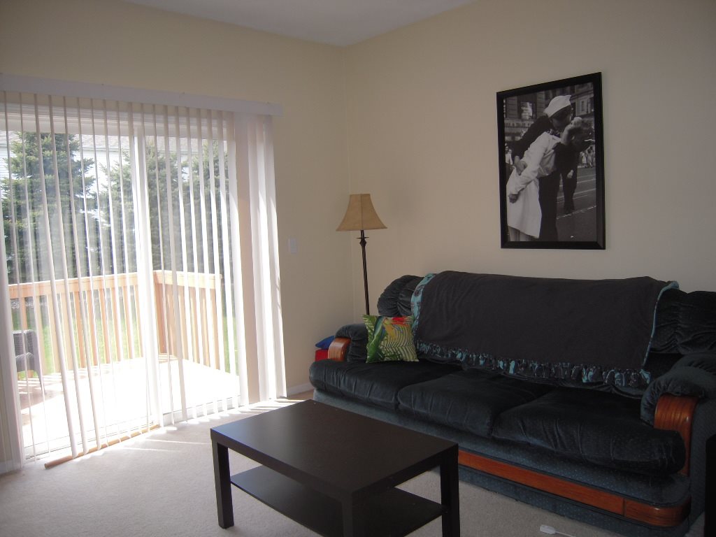 10138 Monarch Road, Unit 2 Roscoe, IL 61073 - Photo 3 of 16 a living room with furniture and a window