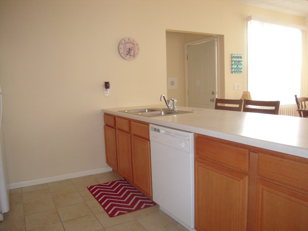 10138 Monarch Road, Unit 2 Roscoe, IL 61073 - Photo 8 of 16 a bathroom with a sink and a mirror
