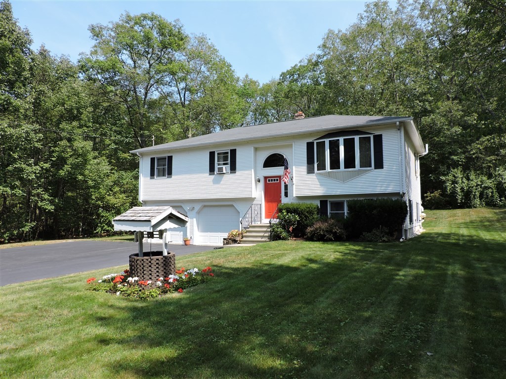 15 Lower Gore Road Webster, MA 01570 - Photo 1 of 30 a front view of a house with a garden