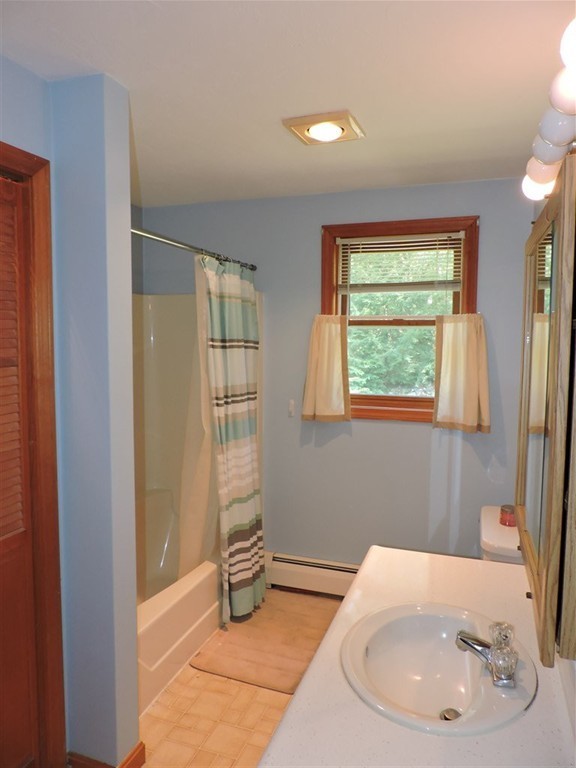 15 Lower Gore Road Webster, MA 01570 - Photo 16 of 30 a bathroom with a sink and a mirror