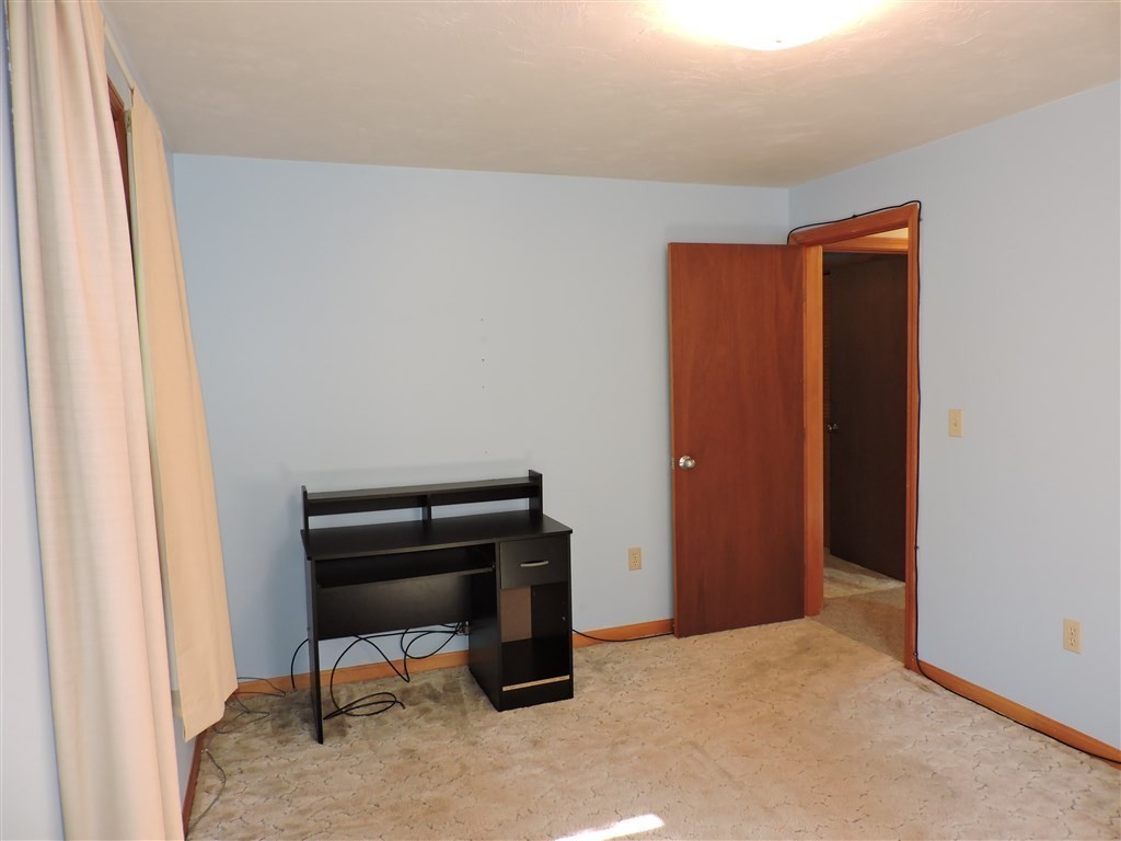 15 Lower Gore Road Webster, MA 01570 - Photo 20 of 30 a room that has a bed and a dresser in it