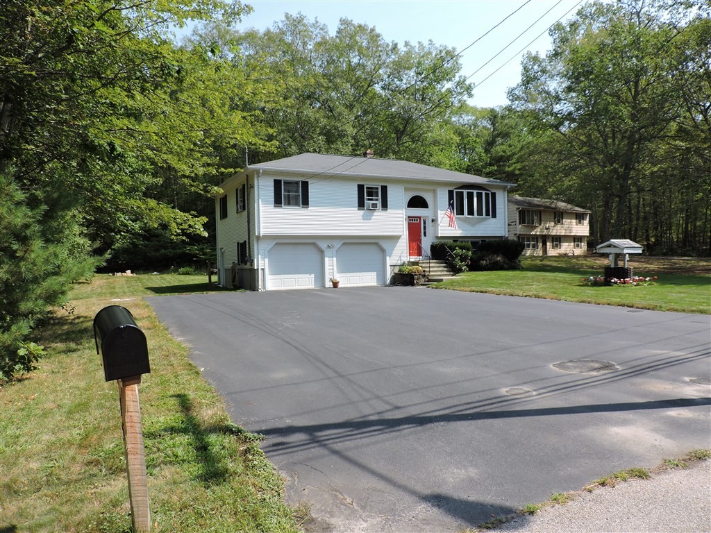 15 Lower Gore Road Webster, MA 01570 - Photo 2 of 30 a front view of a house with garden
