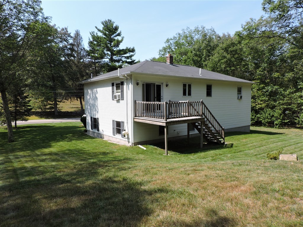 15 Lower Gore Road Webster, MA 01570 - Photo 4 of 30 a house with trees in the background