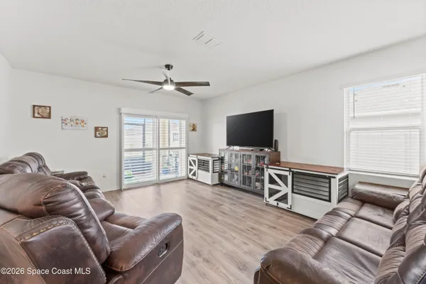 a large kitchen with kitchen island a sink table and chairs