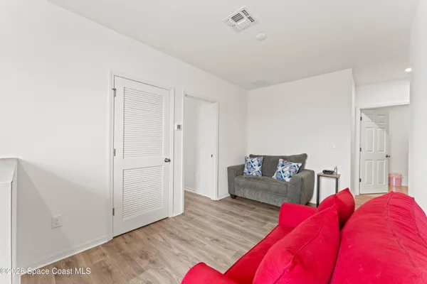 a bedroom with furniture and a window