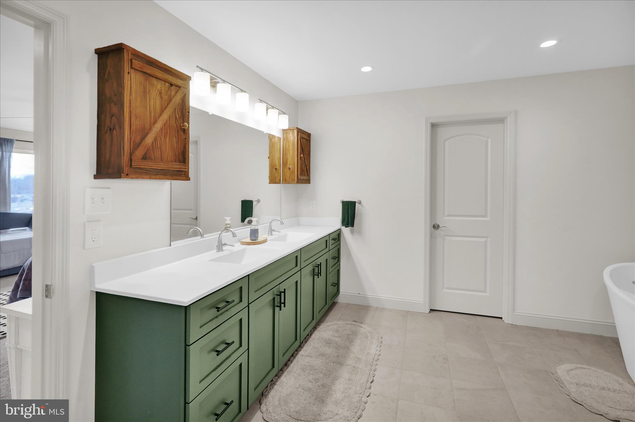 120 Great Bend Way Reading, PA 19608 - Photo 37 of 52 a bathroom with a double vanity sink and mirror
