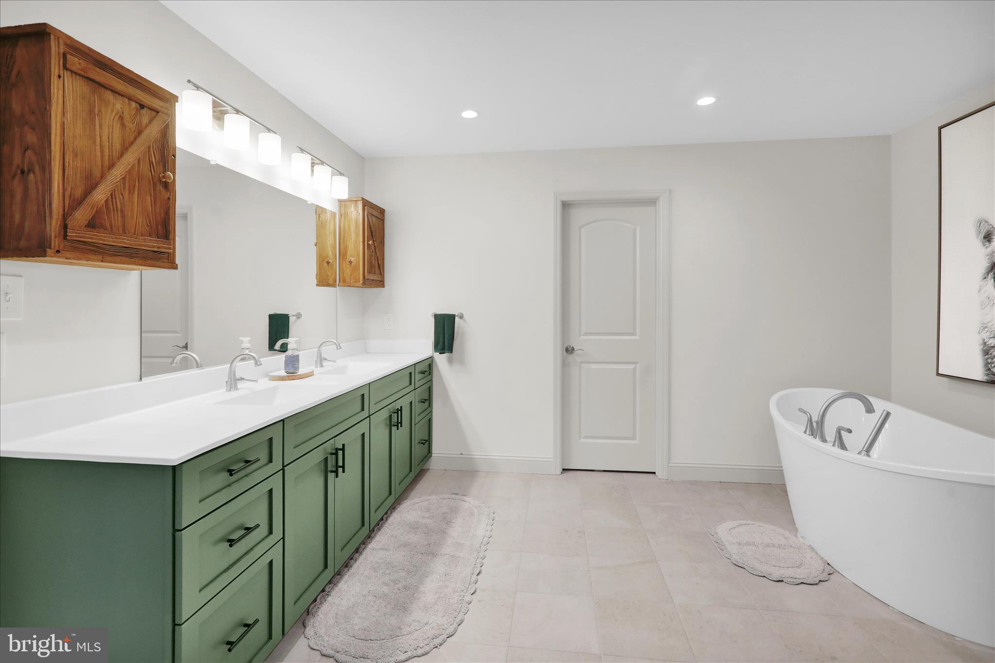 120 Great Bend Way Reading, PA 19608 - Photo 38 of 52 a spacious bathroom with a double vanity sink a mirror and a bathtub