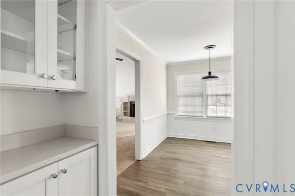 a view of an empty room with windows