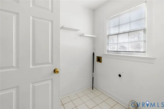 a view of an empty room with windows