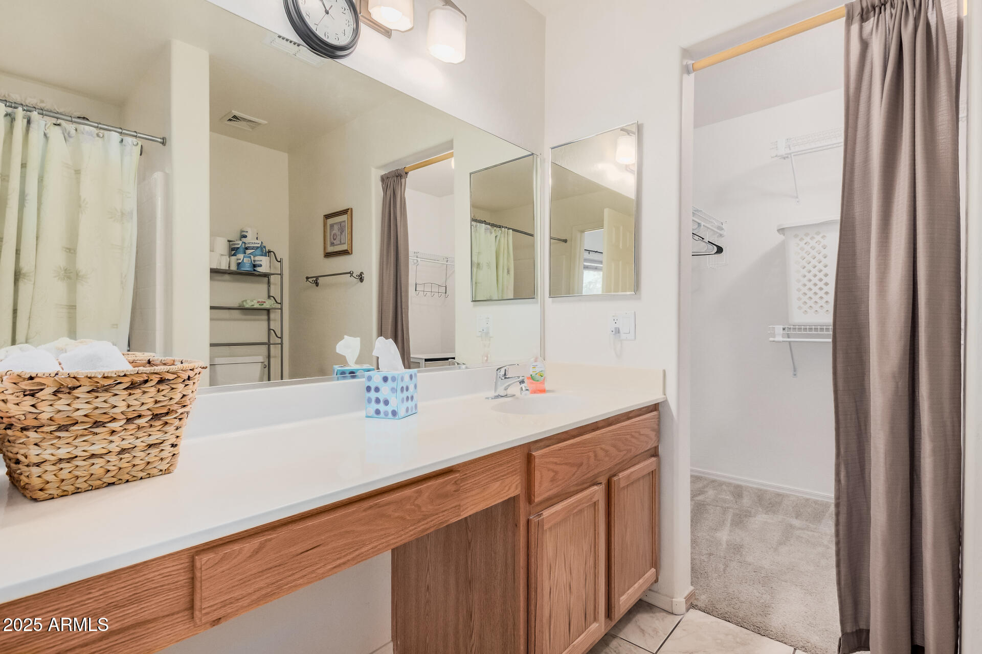 2496 West Tanner Ranch Road San Tan Valley, AZ 85144 - Photo 13 of 25 a bathroom with a sink and a mirror