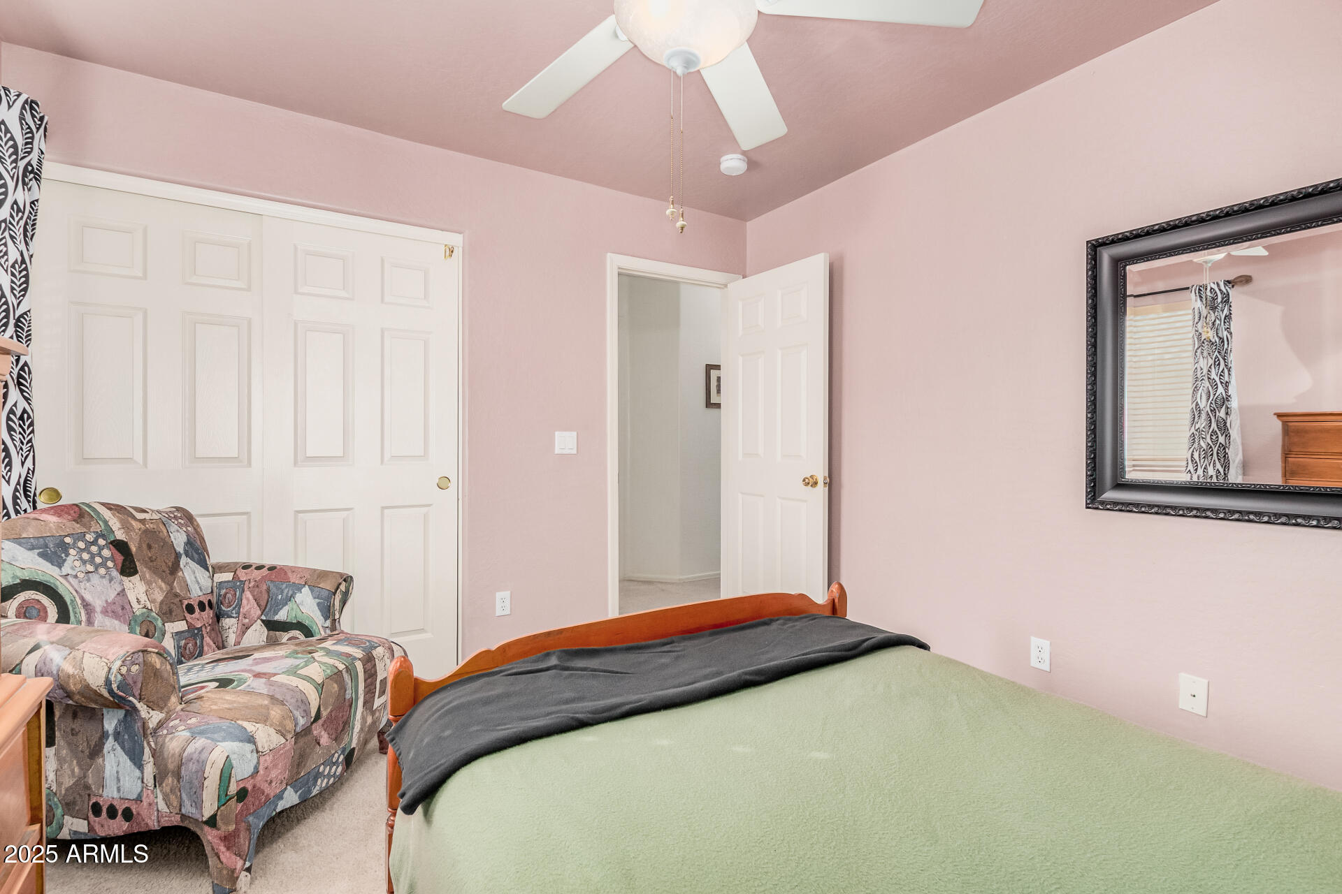 2496 West Tanner Ranch Road San Tan Valley, AZ 85144 - Photo 15 of 25 a bedroom with a bed and a couch
