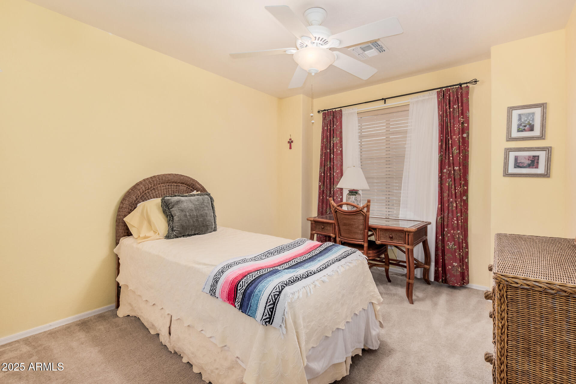 2496 West Tanner Ranch Road San Tan Valley, AZ 85144 - Photo 16 of 25 a bedroom with a bed and a chandelier