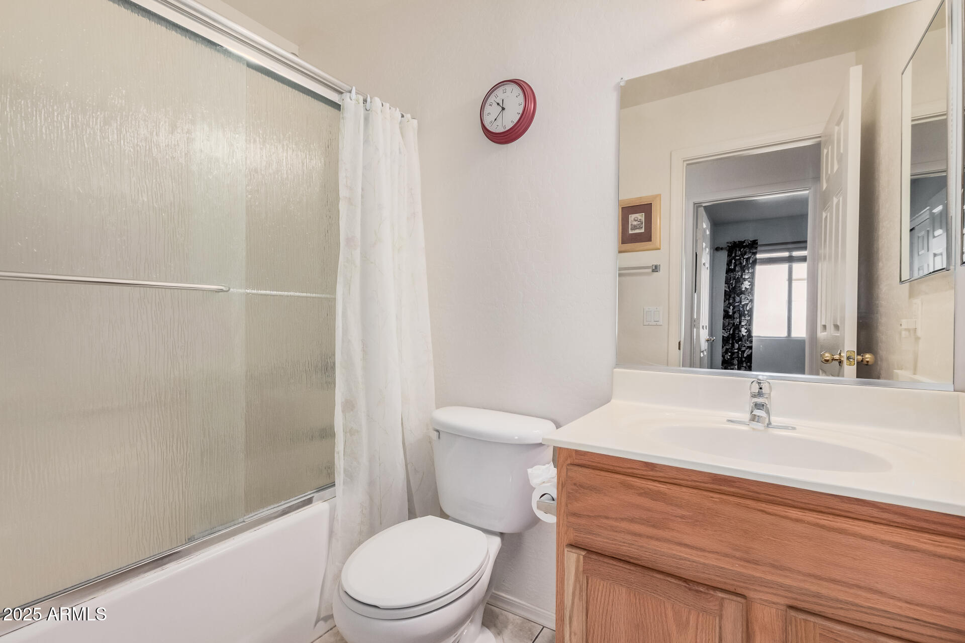 2496 West Tanner Ranch Road San Tan Valley, AZ 85144 - Photo 18 of 25 a bathroom with a sink a toilet and shower