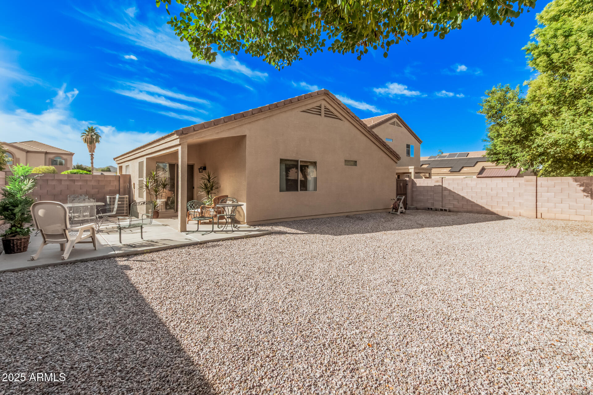 2496 West Tanner Ranch Road San Tan Valley, AZ 85144 - Photo 19 of 25 a view of a house with a backyard