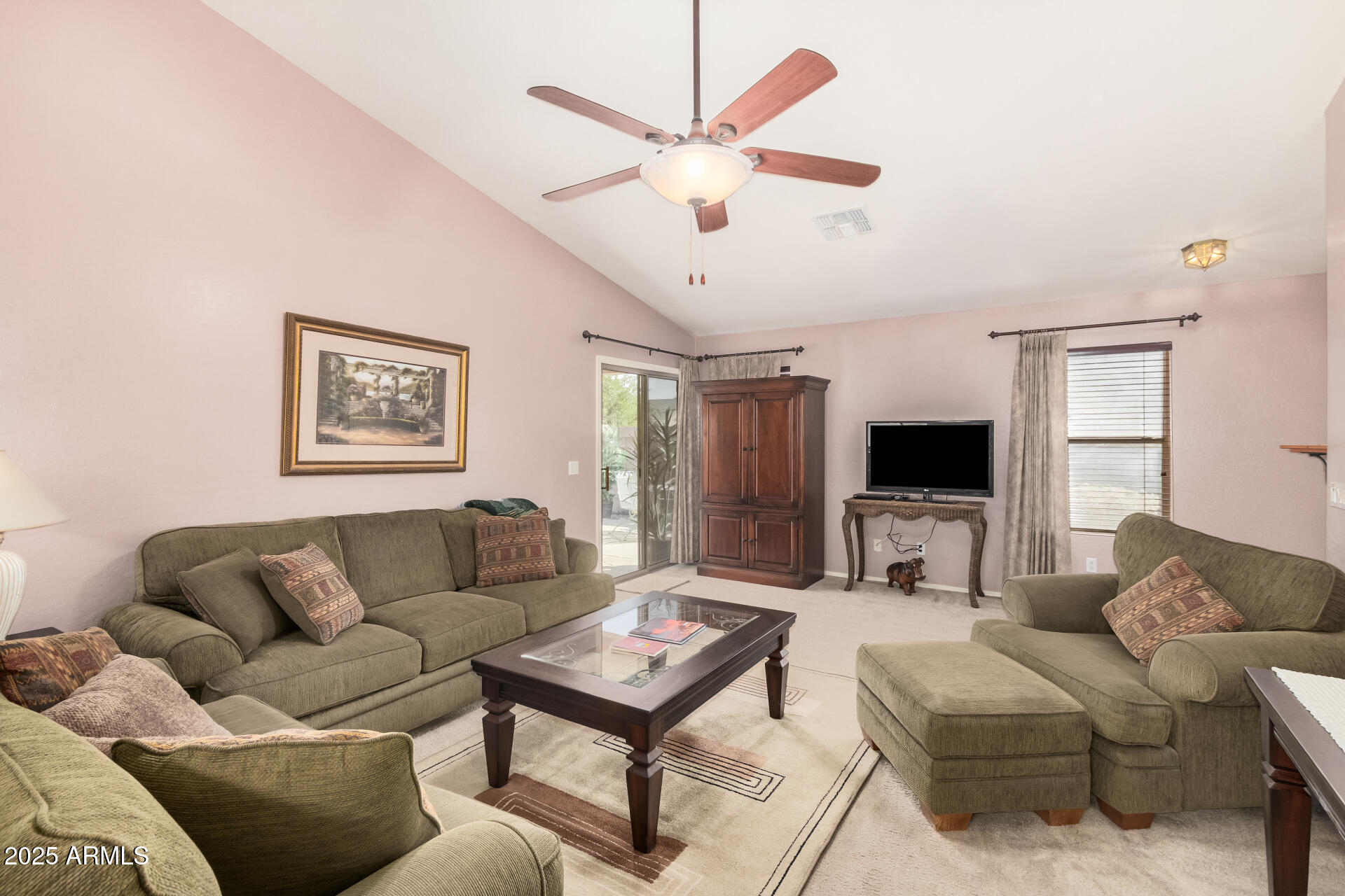 2496 West Tanner Ranch Road San Tan Valley, AZ 85144 - Photo 3 of 25 a living room with furniture and a flat screen tv