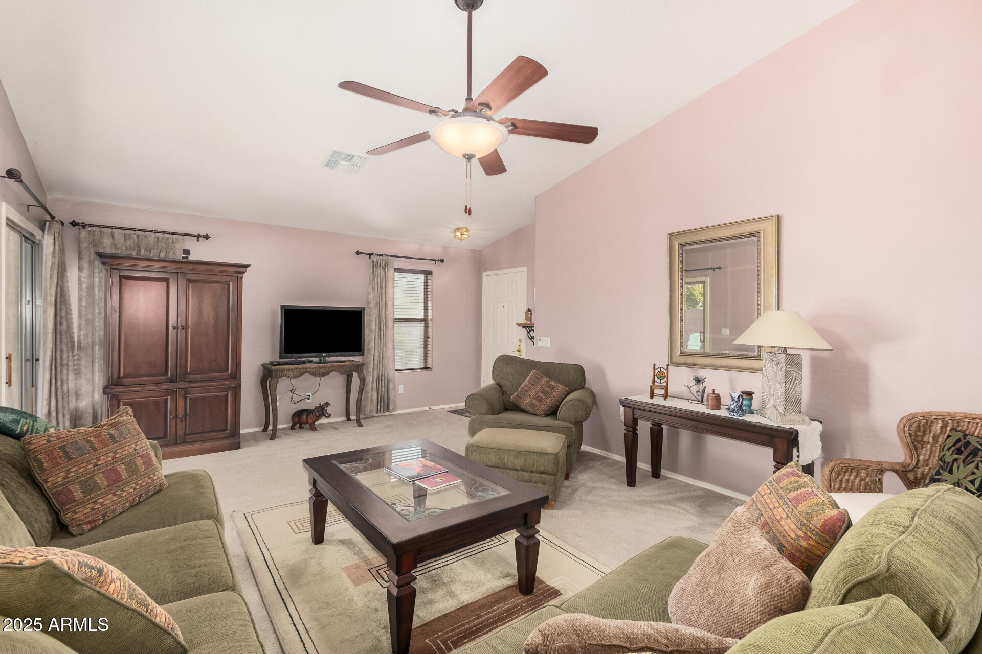 2496 West Tanner Ranch Road San Tan Valley, AZ 85144 - Photo 4 of 25 a living room with furniture and a flat screen tv