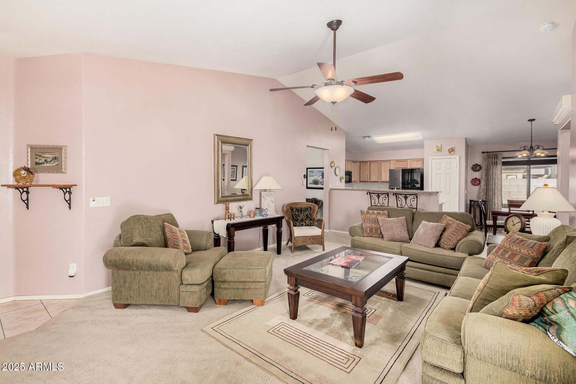 2496 West Tanner Ranch Road San Tan Valley, AZ 85144 - Photo 5 of 25 a living room with furniture kitchen view and a chandelier