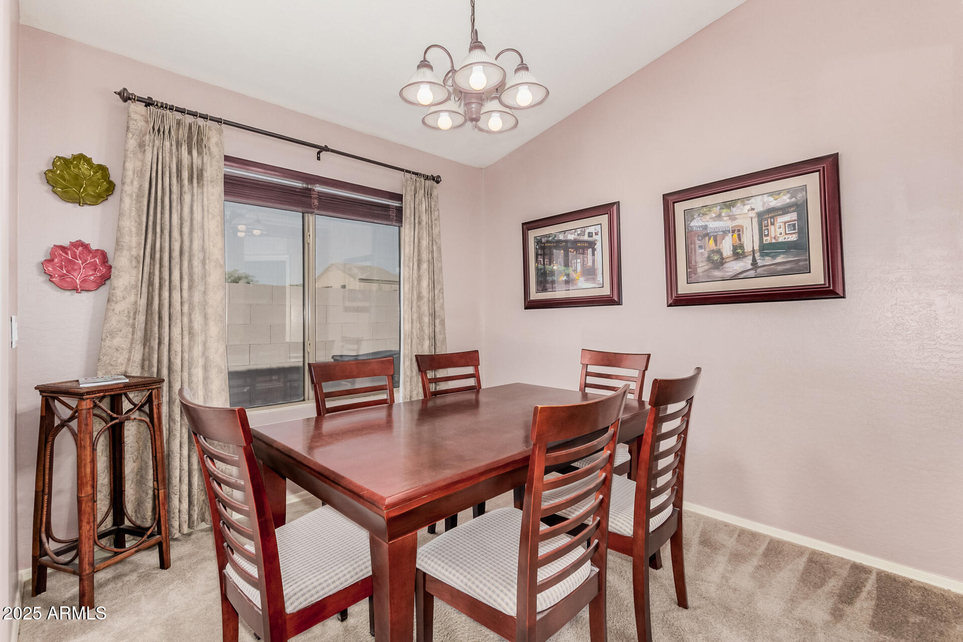 2496 West Tanner Ranch Road San Tan Valley, AZ 85144 - Photo 7 of 25 a view of a dining room with furniture and chandelier