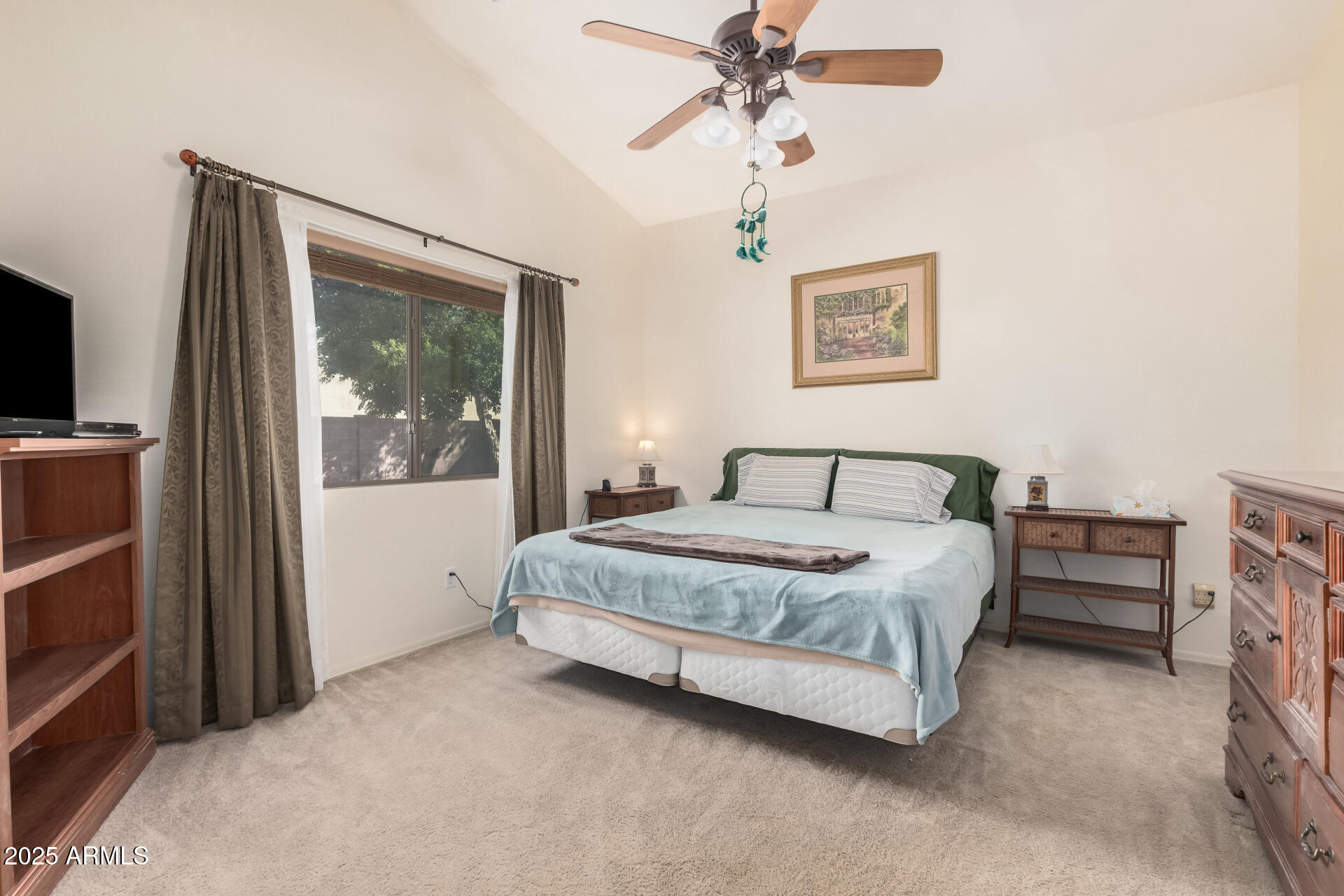 2496 West Tanner Ranch Road San Tan Valley, AZ 85144 - Photo 9 of 25 a bedroom with a bed and a painting on the wall