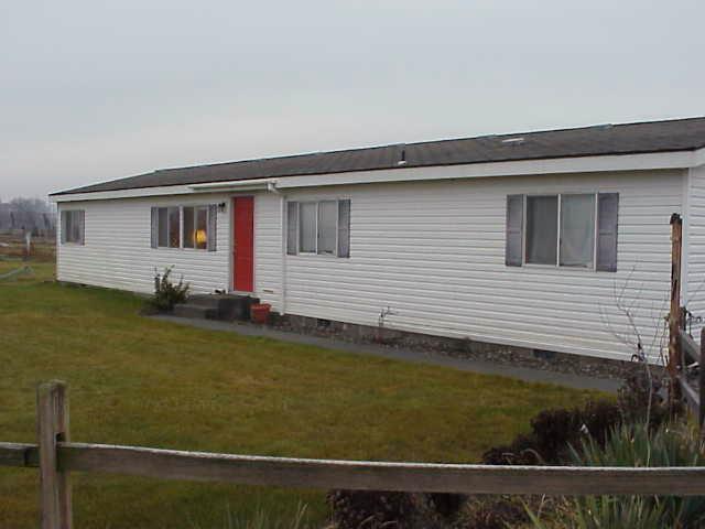 6414 Postma Road Yakima, WA 98901 - Photo 1 of 9 a view of a house with a backyard