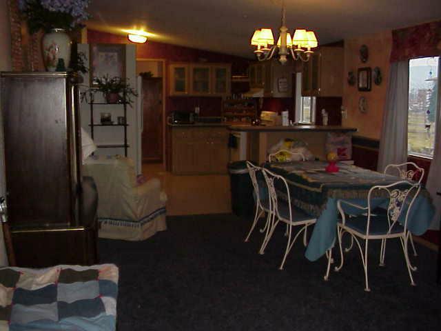 6414 Postma Road Yakima, WA 98901 - Photo 7 of 9 a dining room with furniture and chandelier kitchen view