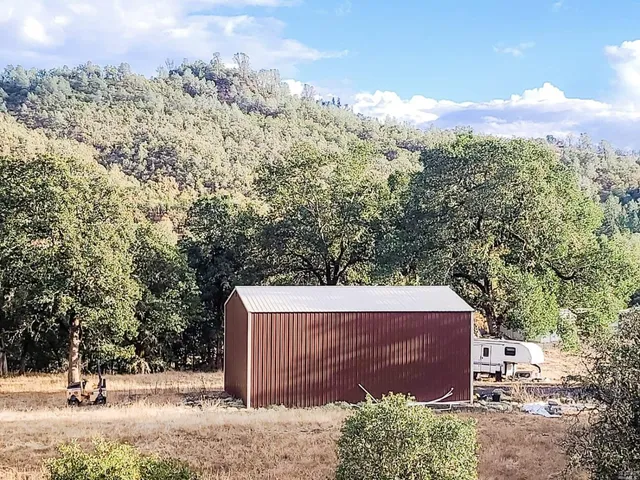 a view of a backyard of the house