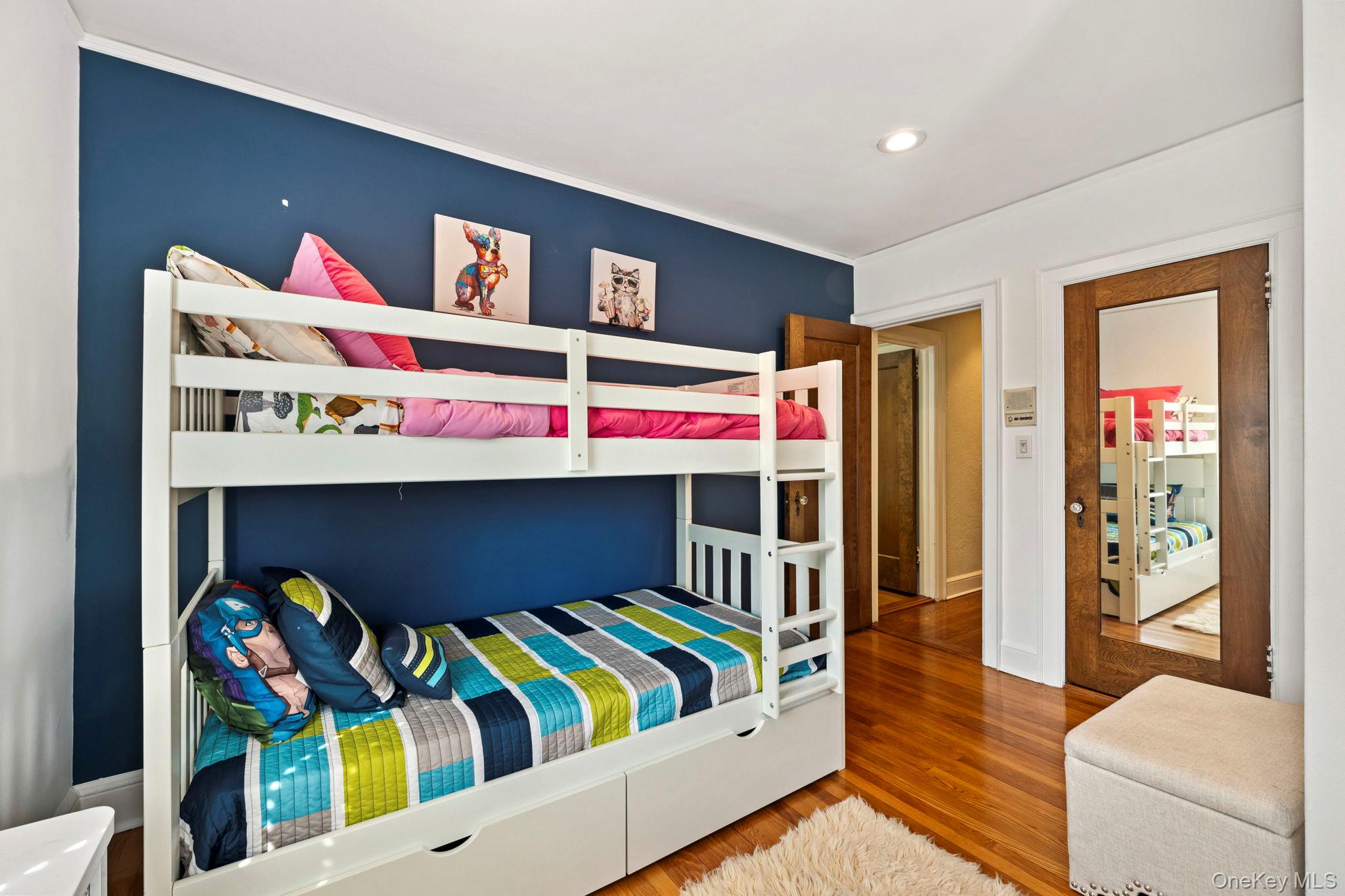 44 Fenimore Road New Rochelle, NY 10804 - Photo 30 of 46 a bedroom with a bed and a bookshelf