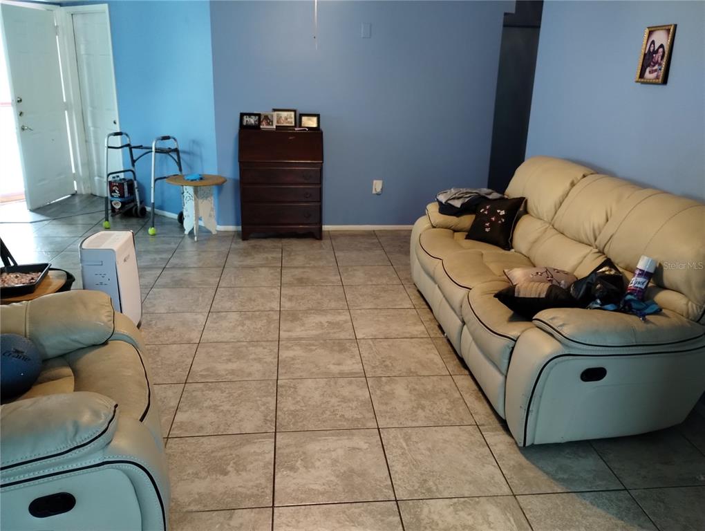 11543 Orleans Lane, Unit B Port Richey, FL 34668 - Photo 5 of 11 a living room with furniture