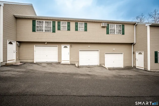 a front view of a house with a garage