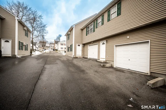a view of a house with a street
