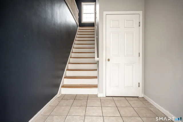 a view of an entryway with wooden floor
