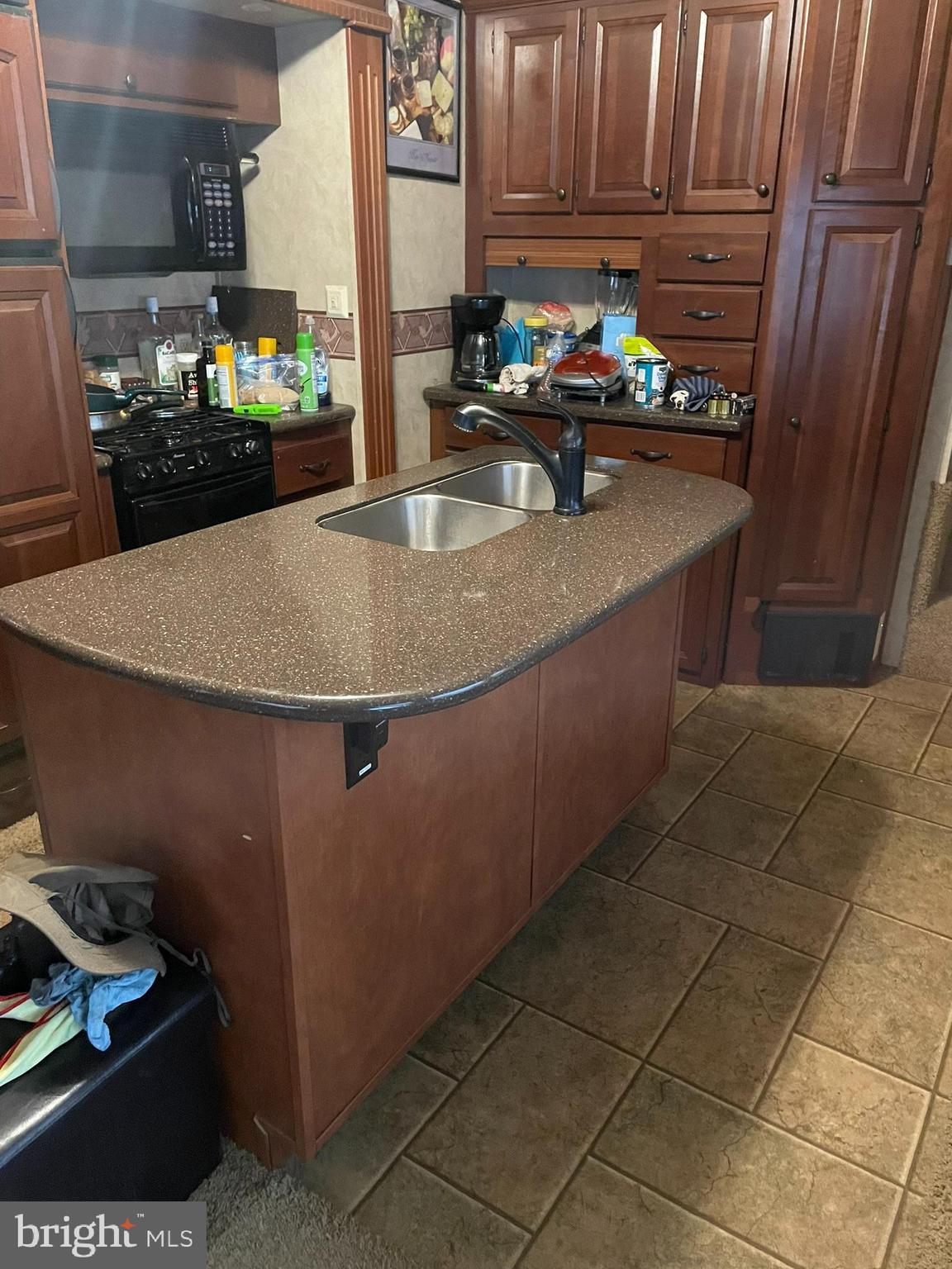 300 Mocanaqua Lane, Unit GLEN 3 Earleville, MD 21919 - Photo 4 of 17 a kitchen with granite countertop a sink and a stove