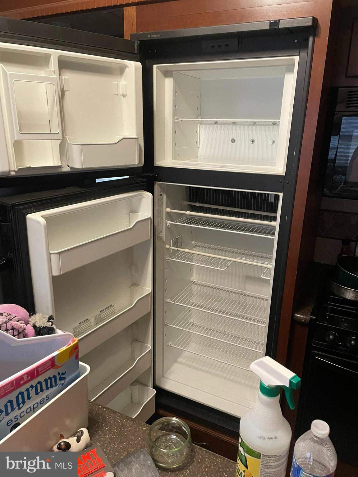 300 Mocanaqua Lane, Unit GLEN 3 Earleville, MD 21919 - Photo 6 of 17 a room with gym equipment and a lamp on dresser