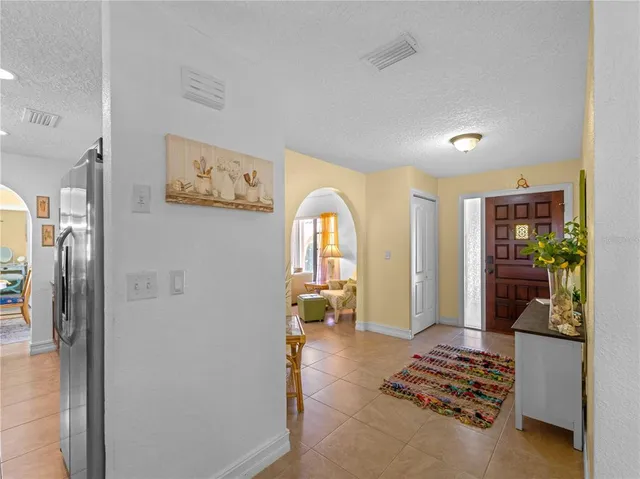 a view of a dining room with furniture and window