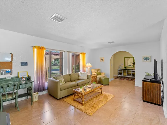 a view of a dining room with furniture and window