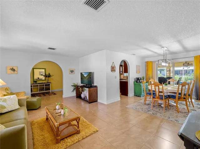 a kitchen with stainless steel appliances granite countertop a sink stove and microwave