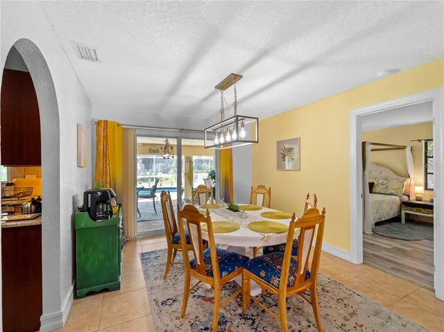 a large kitchen with stainless steel appliances lots of counter top space