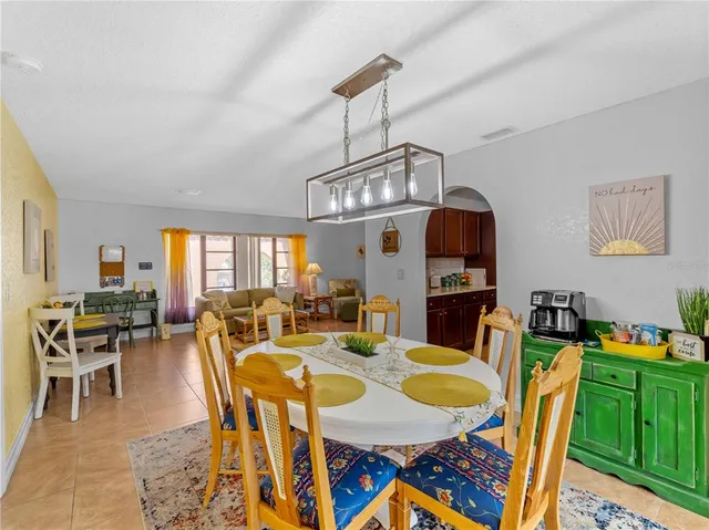 a kitchen with stainless steel appliances granite countertop a refrigerator stove microwave and sink