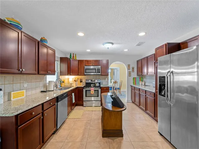 a living room with furniture and fireplace