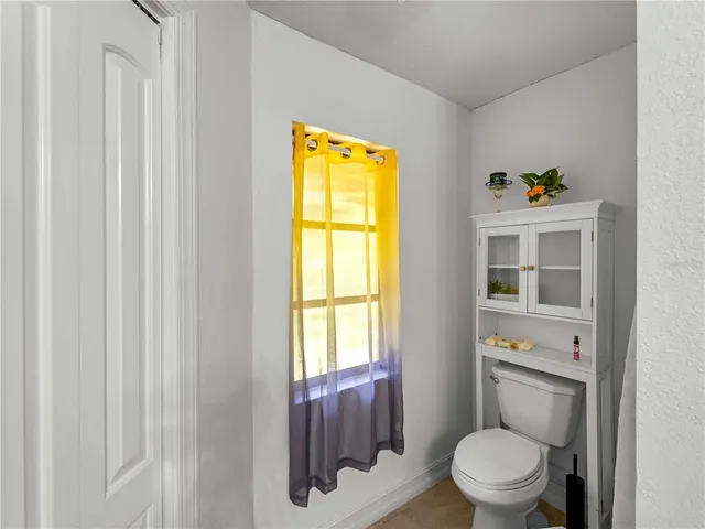 a bed room with a bed and a chandelier