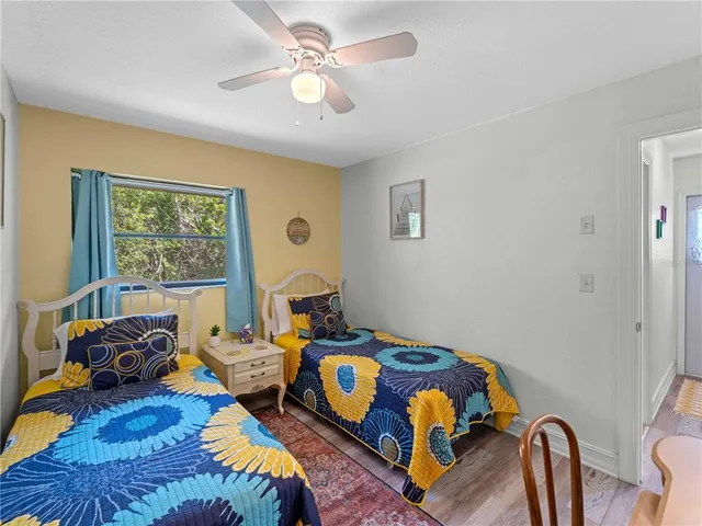 a dining room with furniture water view and a floor to ceiling window