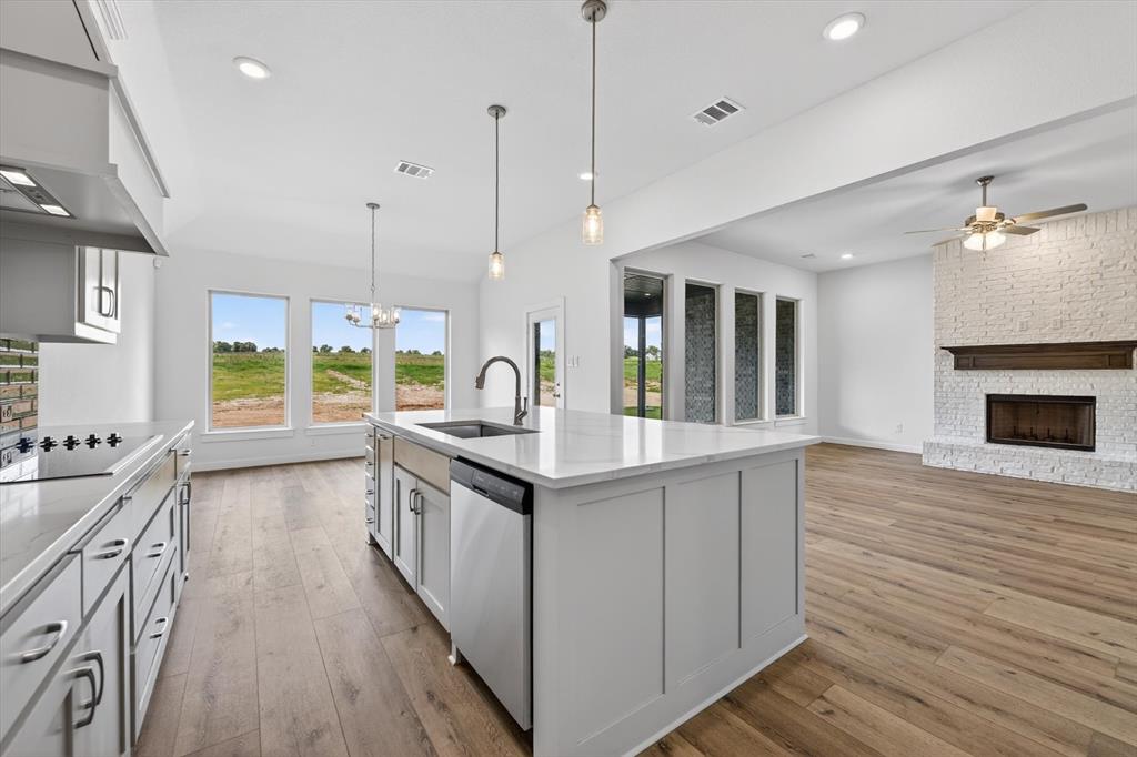 416 McAlpine Drive Springtown, TX 76082 - Photo 20 of 40 Open concept interior featuring wood-finish flooring throughout