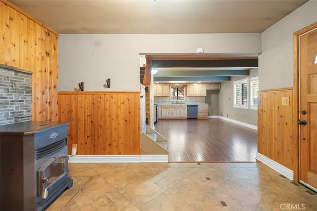 a view of a kitchen with a dishwasher and a large window