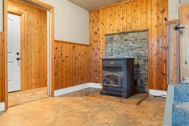 a kitchen with granite countertop a stove a sink and a microwave