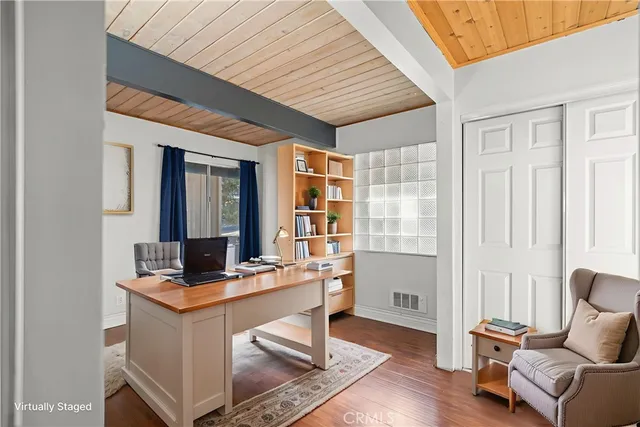 a bedroom with a bed a couch and dresser