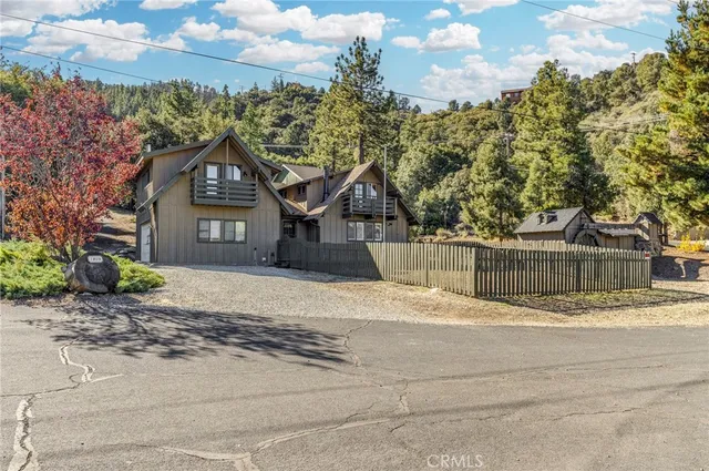 a view of a house with a yard and garage