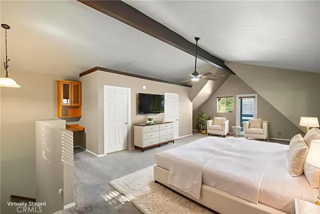 a bedroom with a bed a couch and dresser